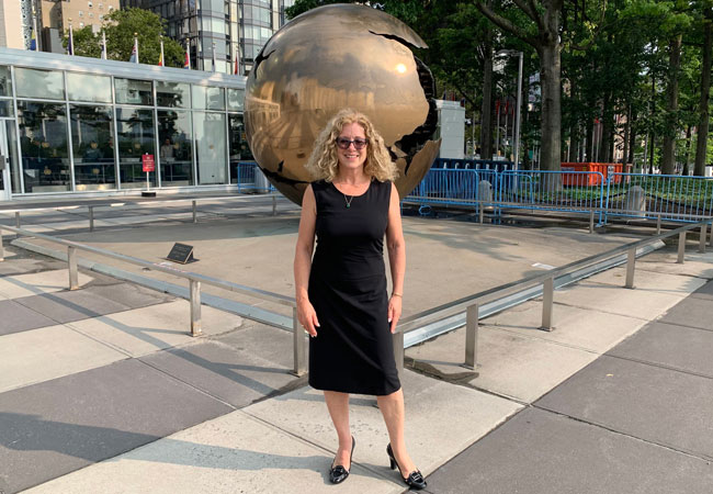 Julia Christensen Hughes outside UN Headquarters in New York City