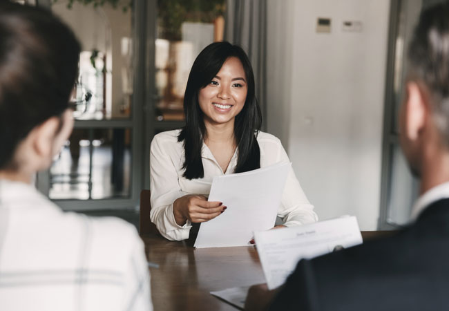 Job interview with people smiling  