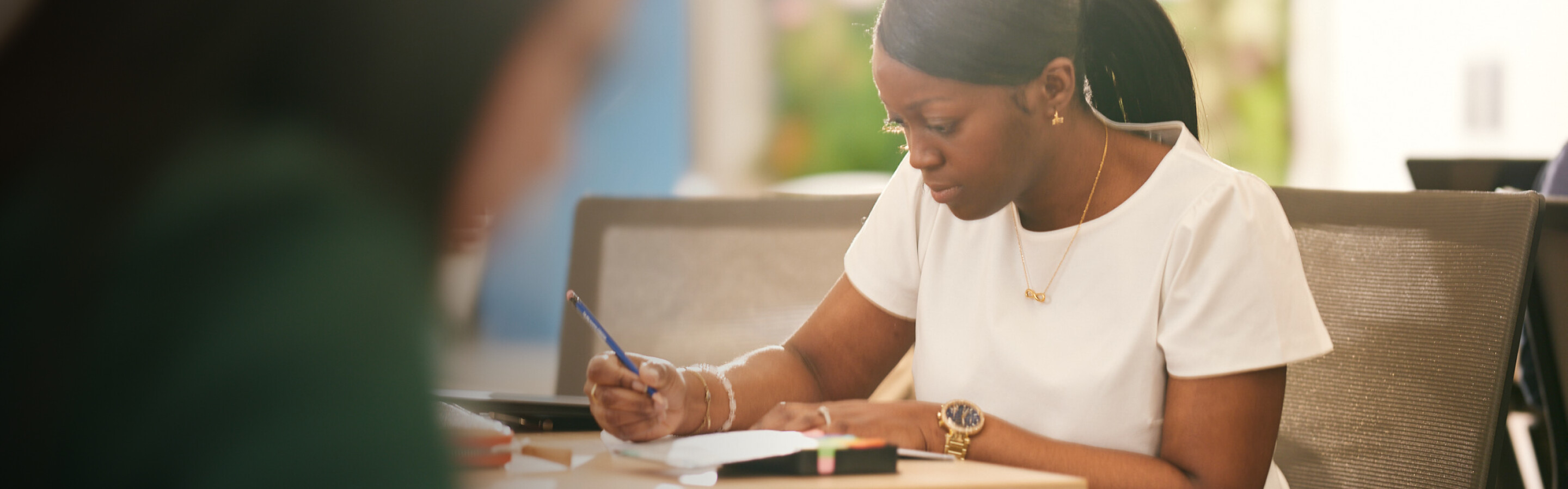 Female student working at a desk