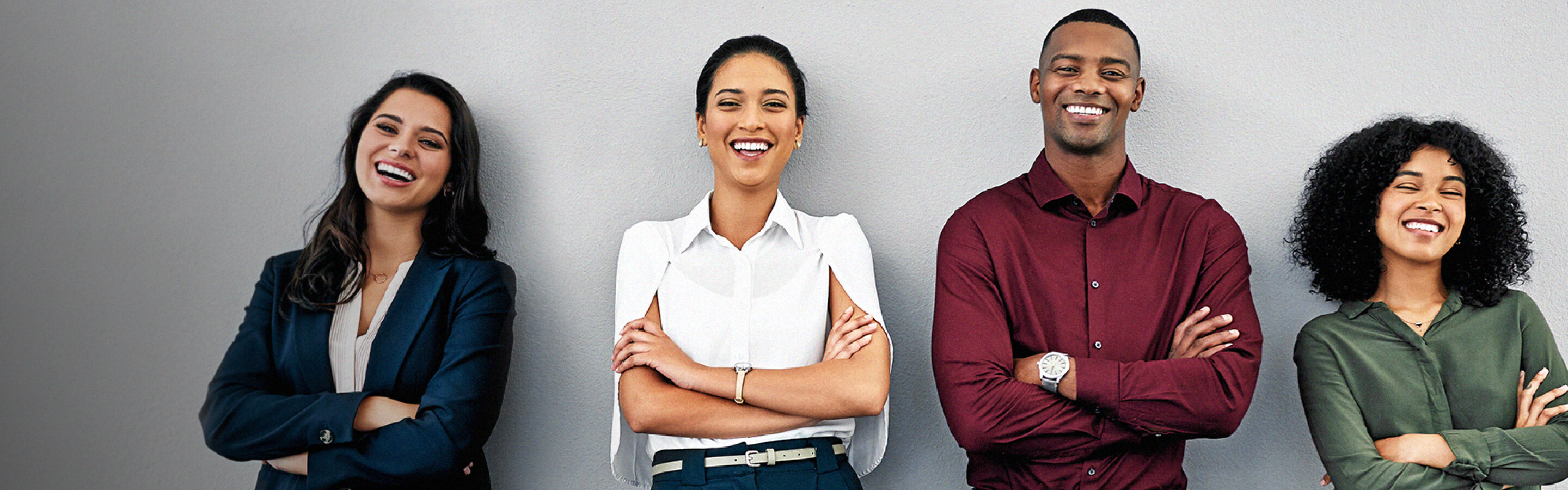 Three people standing together in a line