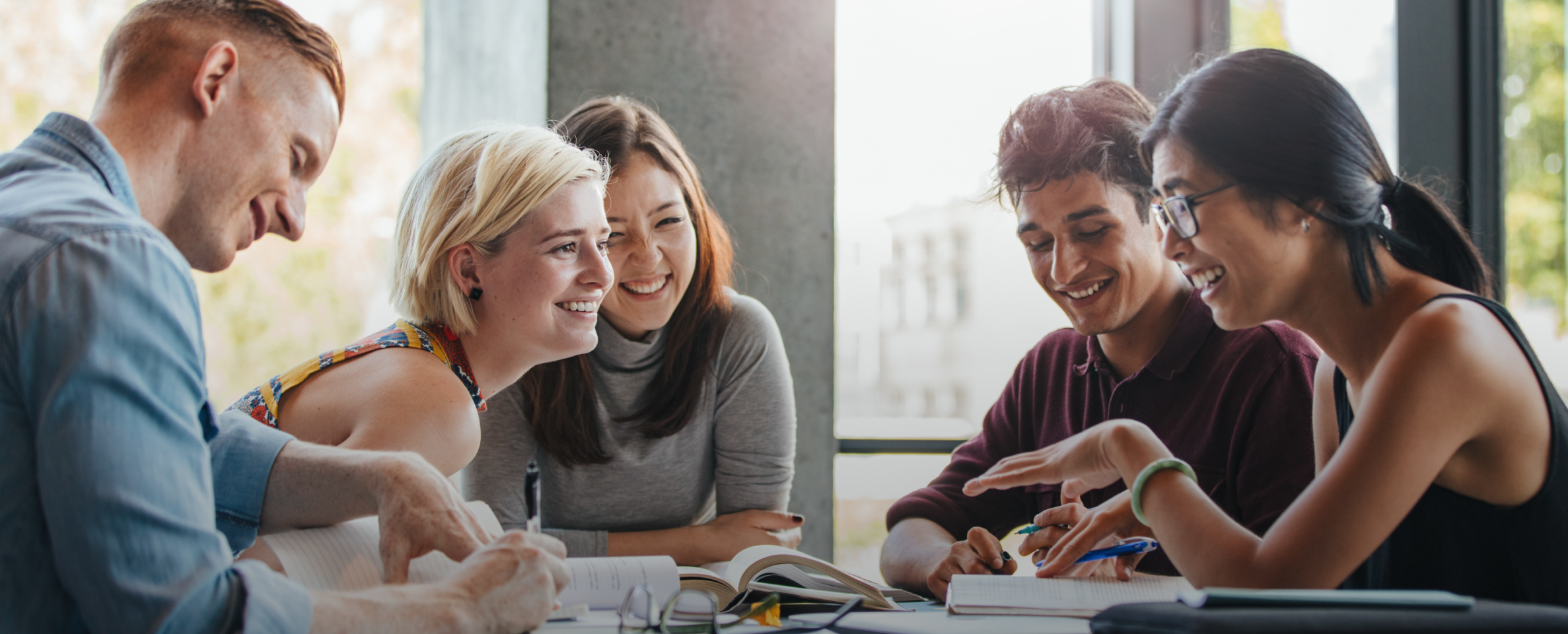 A group of students sitting around a table working together